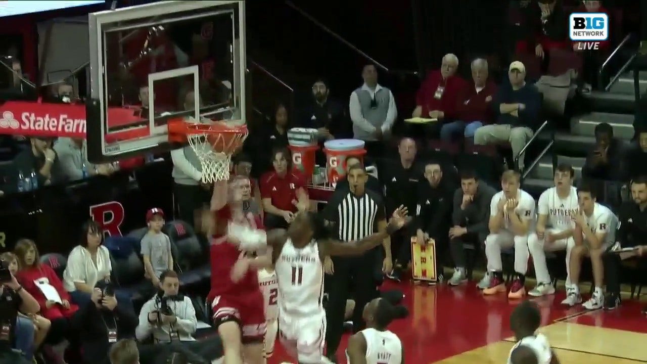 Wisconsin's Steven Crowl puts his defender on a poster with a dunk and helps trim the lead