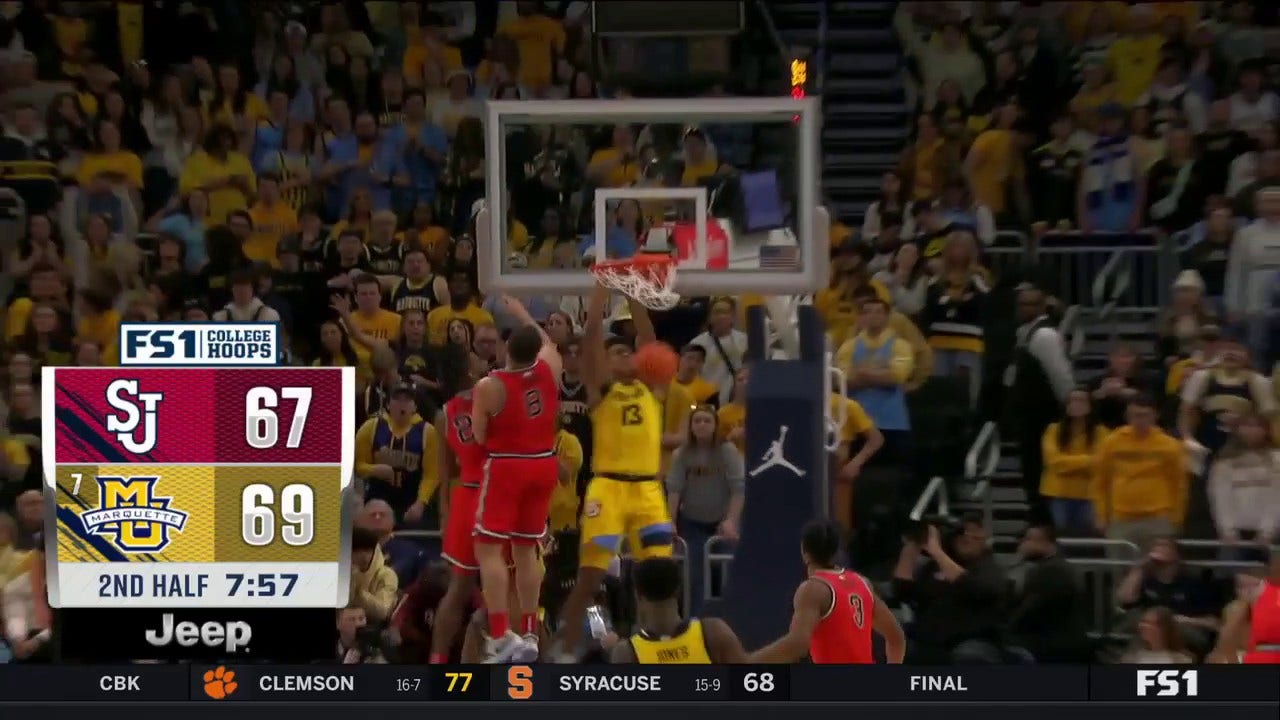 Oso Ighodaro dunks on his defender, giving Marquette the lead over St. John's