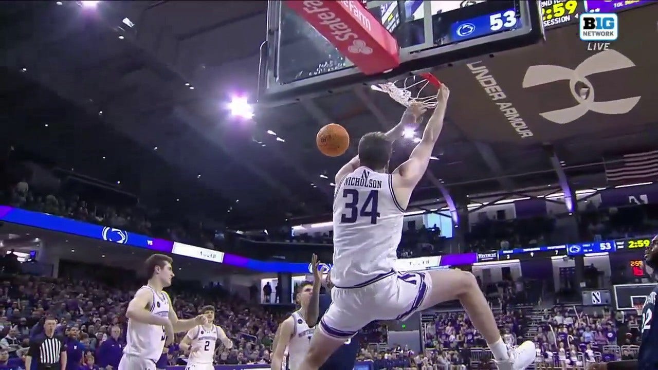 Northwestern's Matthew Nicholson finishes the two-handed slam to increase the lead against Penn State