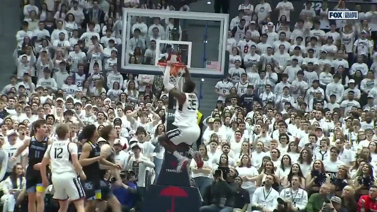 UConn's Samson Johnson HAMMERS a two-handed alley-oop against Marquette