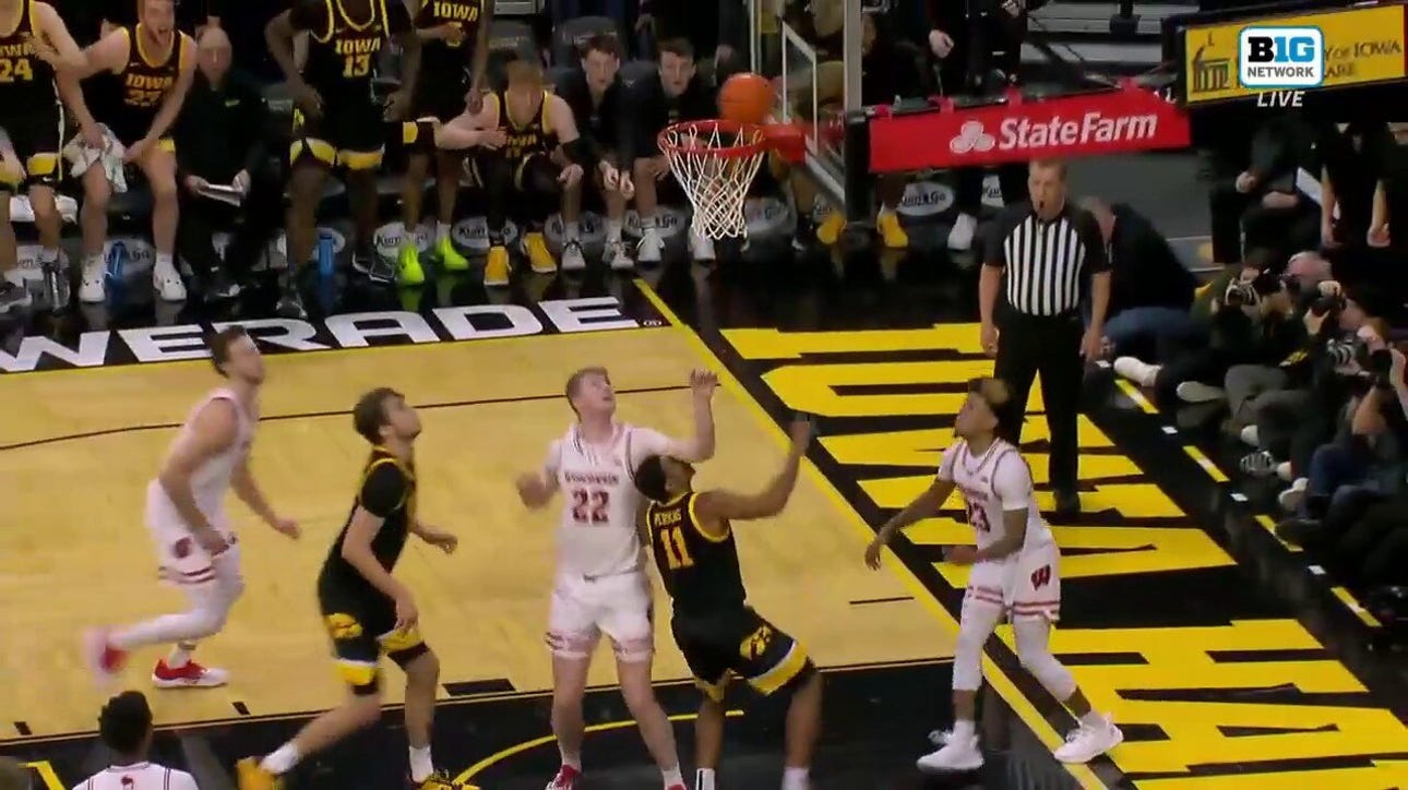 Tony Perkins' last-second double-clutch layup WINS it for Iowa over No. 20 Wisconsin in OT