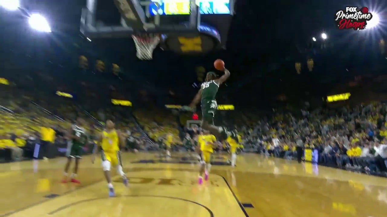 Michigan State's Coen Carr finishes the one-handed jam to extend the lead over Michigan