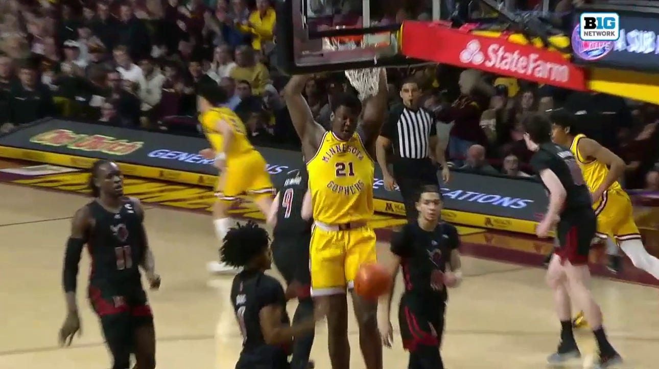 Minnesota's Pharrel Payne finishes the two-handed jam to close the gap with Rutgers
