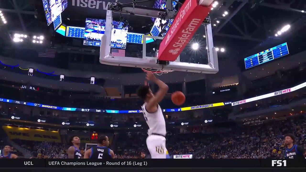 Iso Ighodaro rises for a two-handed alley-oop to extend Marquette's lead over DePaul