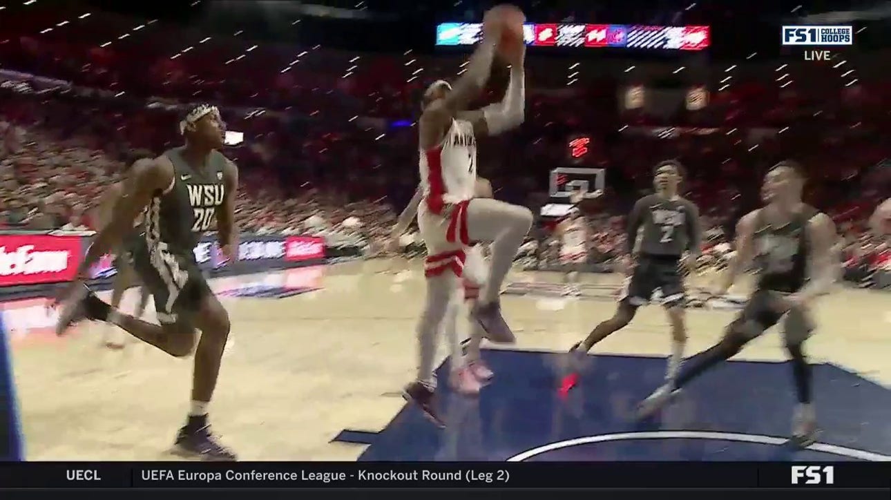 Arizona's Caleb Love explodes for a tough two-handed jam against the Washington State