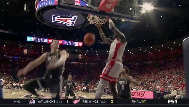 Arizona's Pelle Larsson connects with Oumar Ballo on the alley-oop vs. Washington St