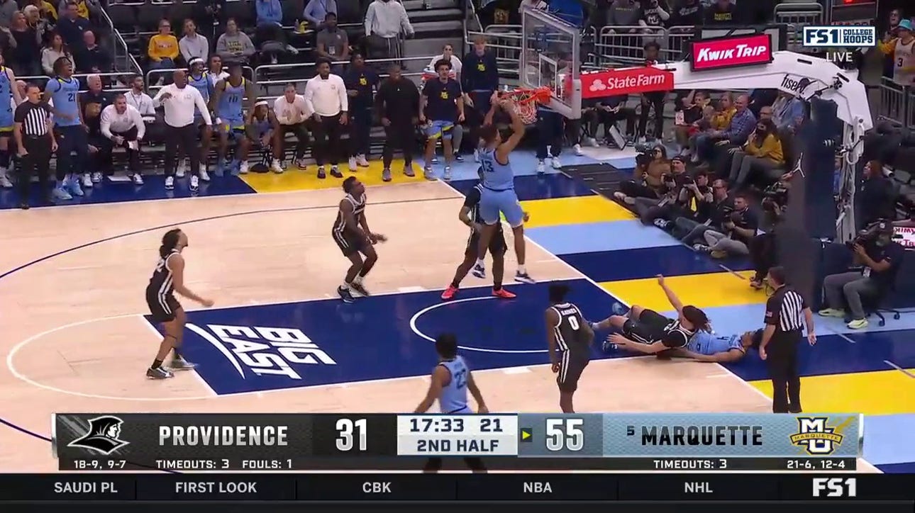 Oso Ighodaro slams a dunk off a rebound to extend Marquette's lead over Providence