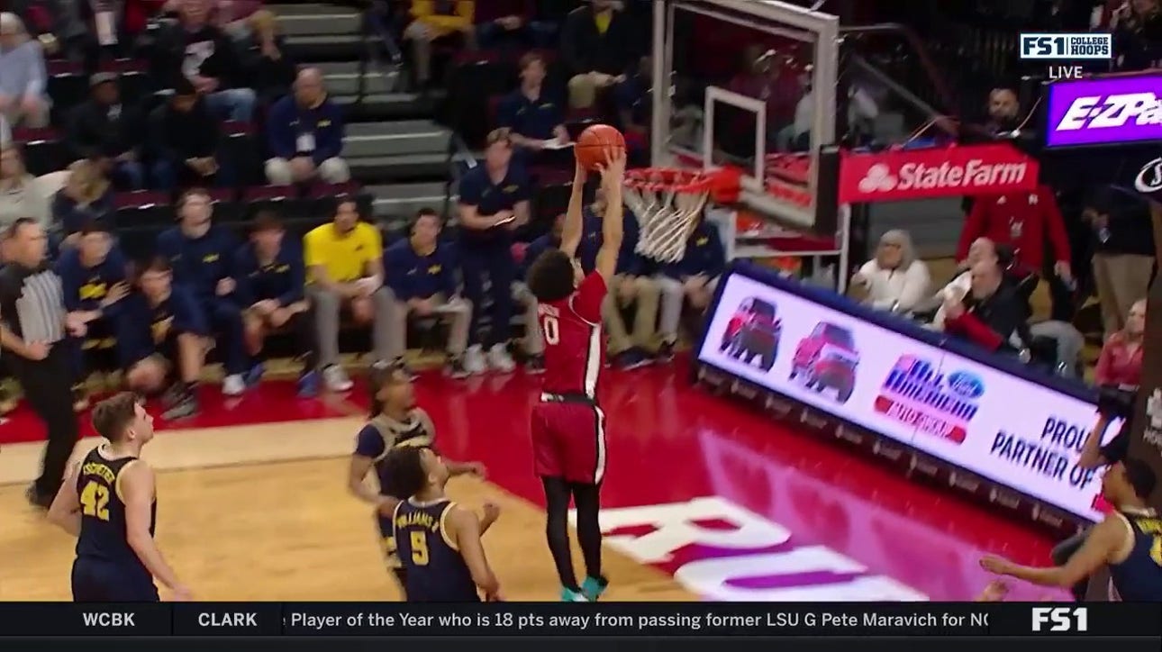 Derek Simpson throws down a vicious two-handed slam to extend Rutgers' lead over Michigan