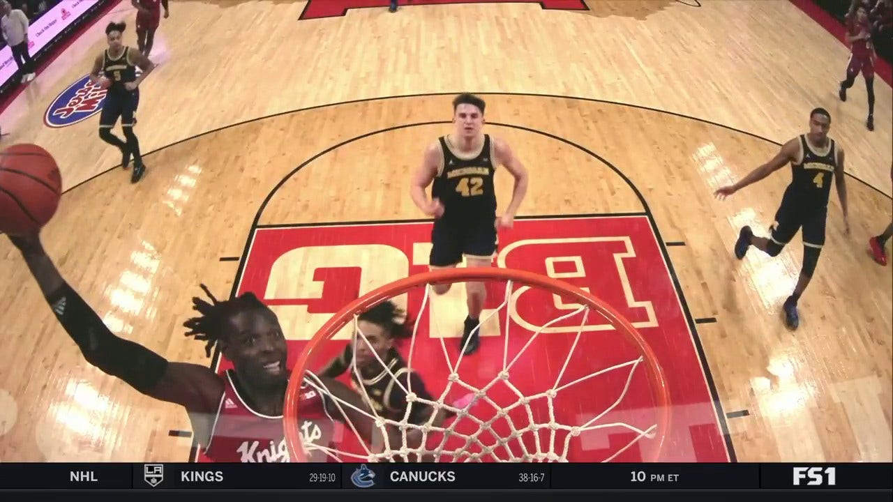 Rutgers' Clifford Omoruyi throws down the one-handed jam to extend lead over Michigan