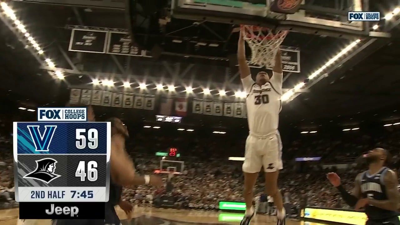 Providence's Rafael Castro skies for a ferocious alley-oop against Villanova