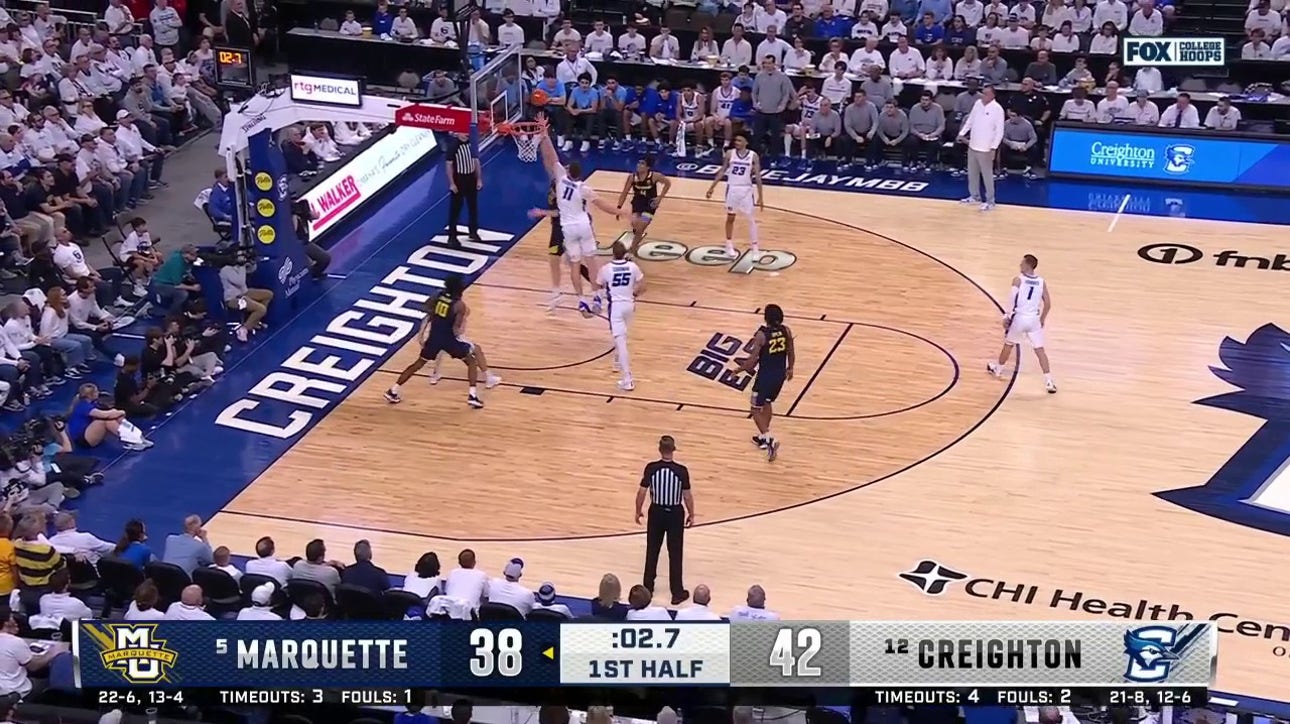 Marquette's Ben Gold finishes a last-second layup to shrink Creighton's lead to 2 at halftime