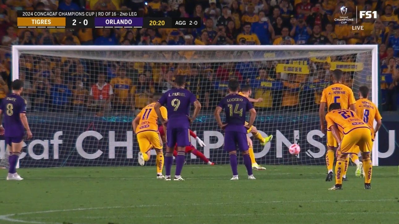 Tigres André-Pierre Gignac punches in a penalty kick to lead 2-0 over Orlando FC