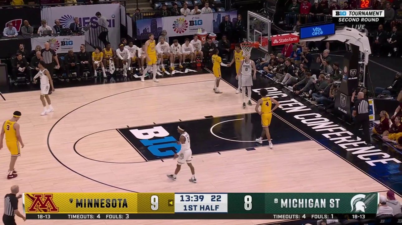 Michigan State's Xavier Booker threw down a dunk, trimming into Minnesota's lead