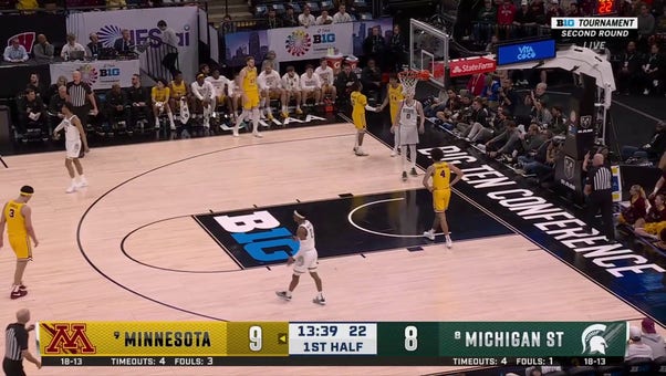 Michigan State's Xavier Booker threw down a dunk, trimming into Minnesota's lead