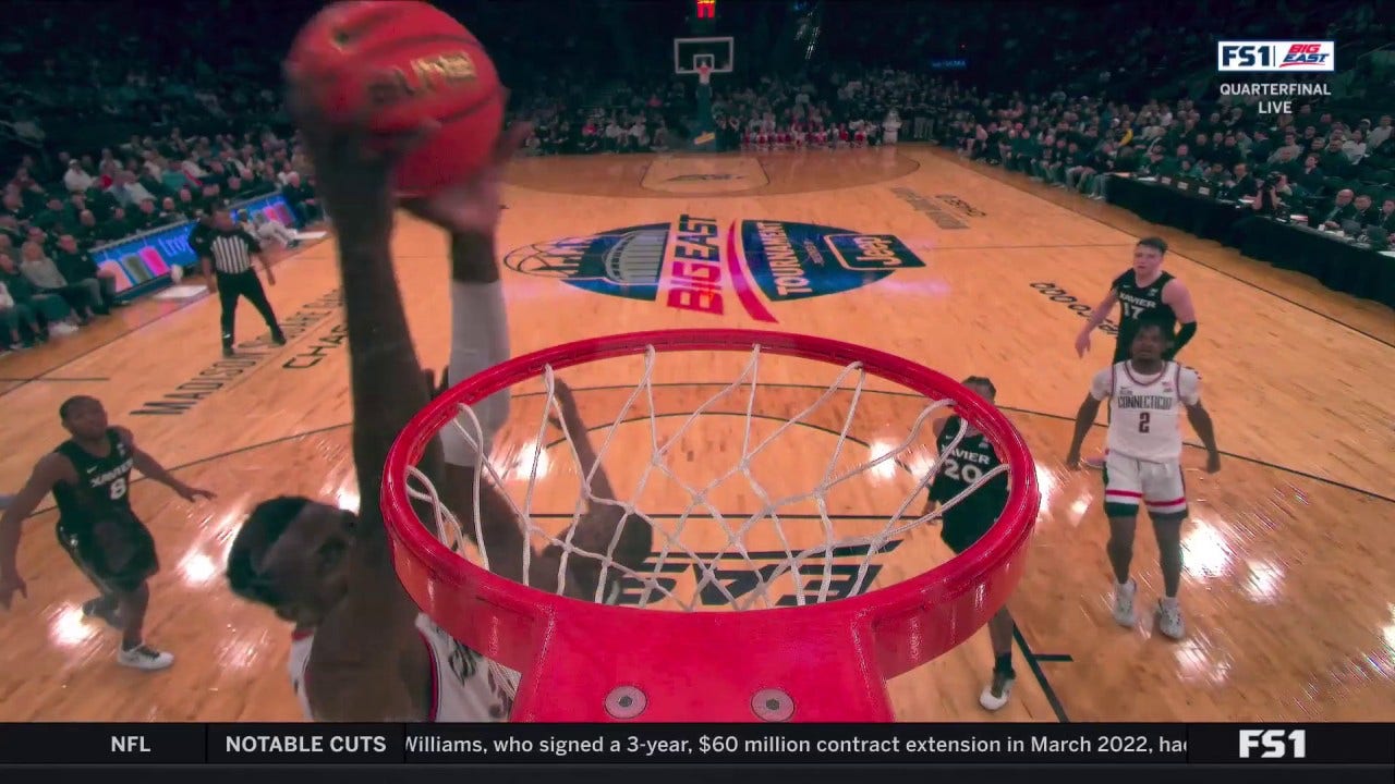 Samson Johnson throws down an alley-oop dunk, giving UConn the lead vs. Xavier