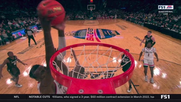 Samson Johnson throws down an alley-oop dunk, giving UConn the lead vs. Xavier