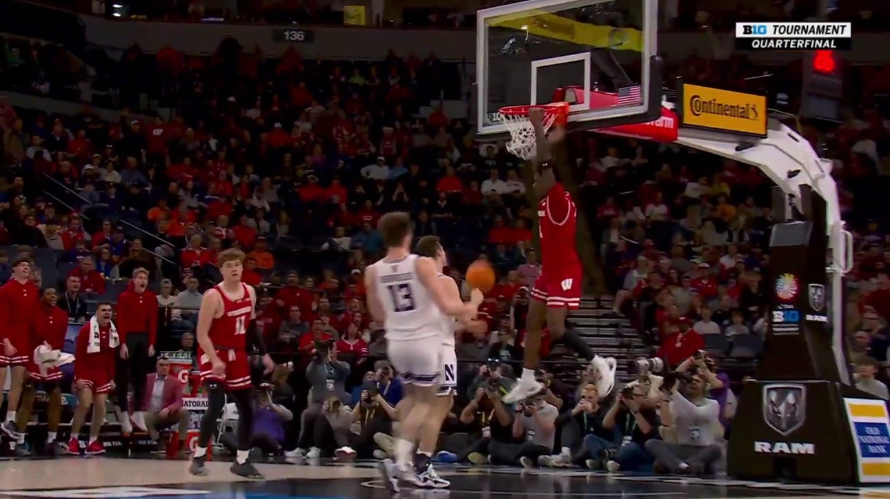 AJ Storr skies for the alley-oop slam in transition to extend Wisconsin's lead over Northwestern