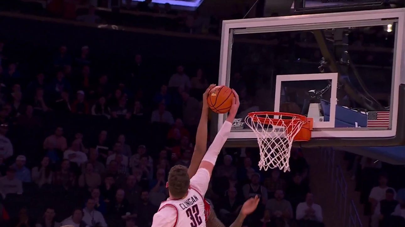 UConn's Donovan Clingan turns a big block into a crafty and-1 at the other end for Hassan Diarra to shrink St. John's lead