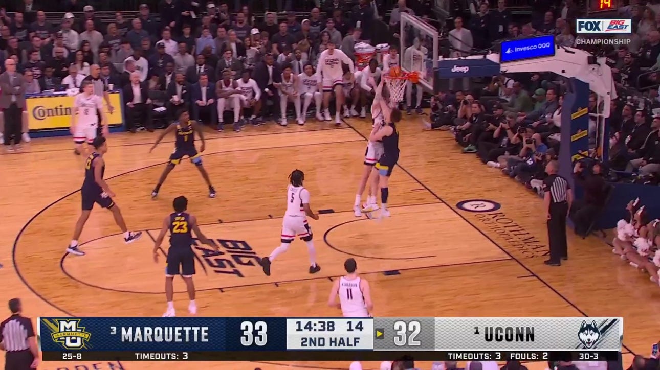 Donovan Clingan slams down the posterizer to give UConn a 34-33 lead over Marquette