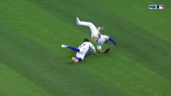 Rangers' Marcus Semien and Adolis García collide after going after a fly ball