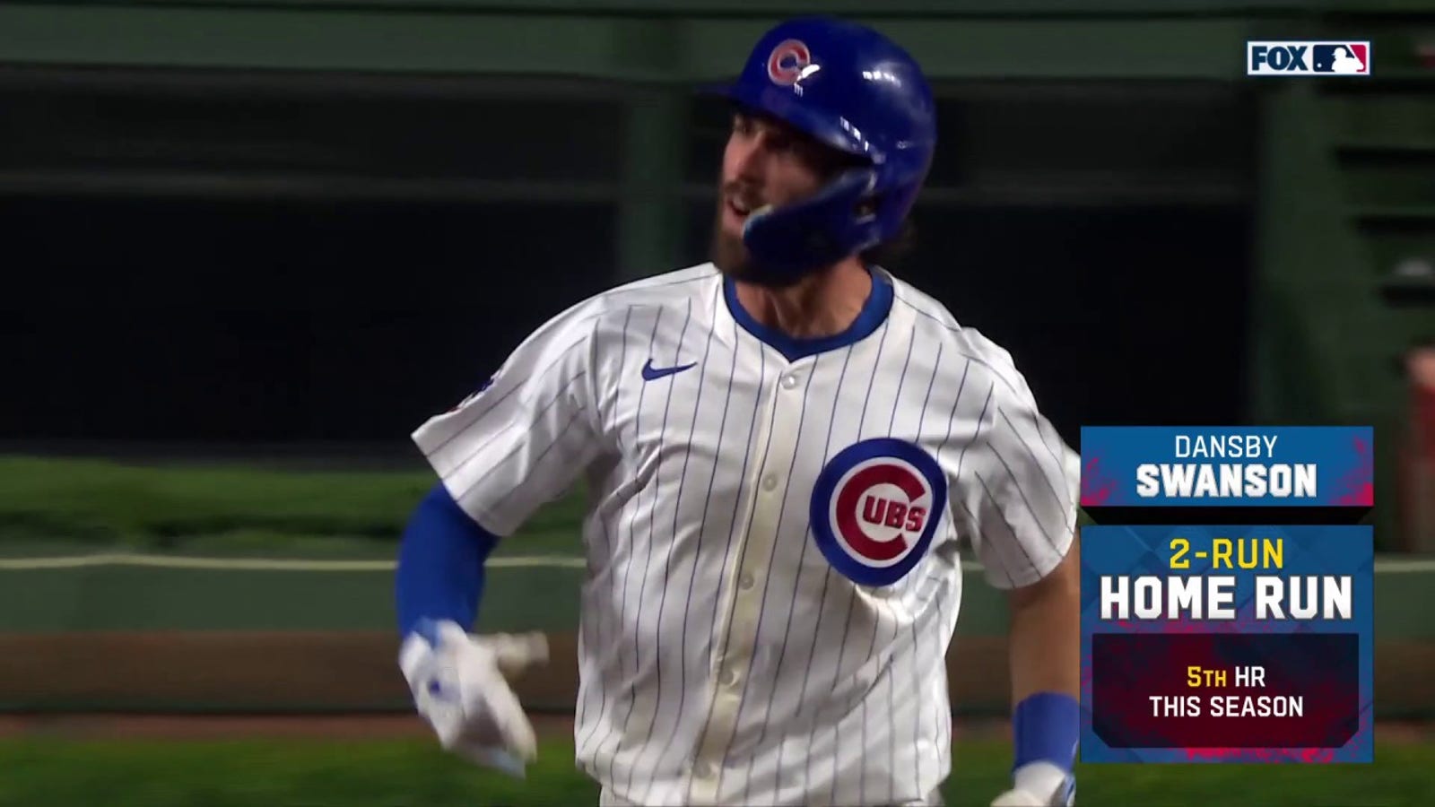 Dansby Swanson crushes a two-run home run to give the Cubs a 7-5 lead over the Reds