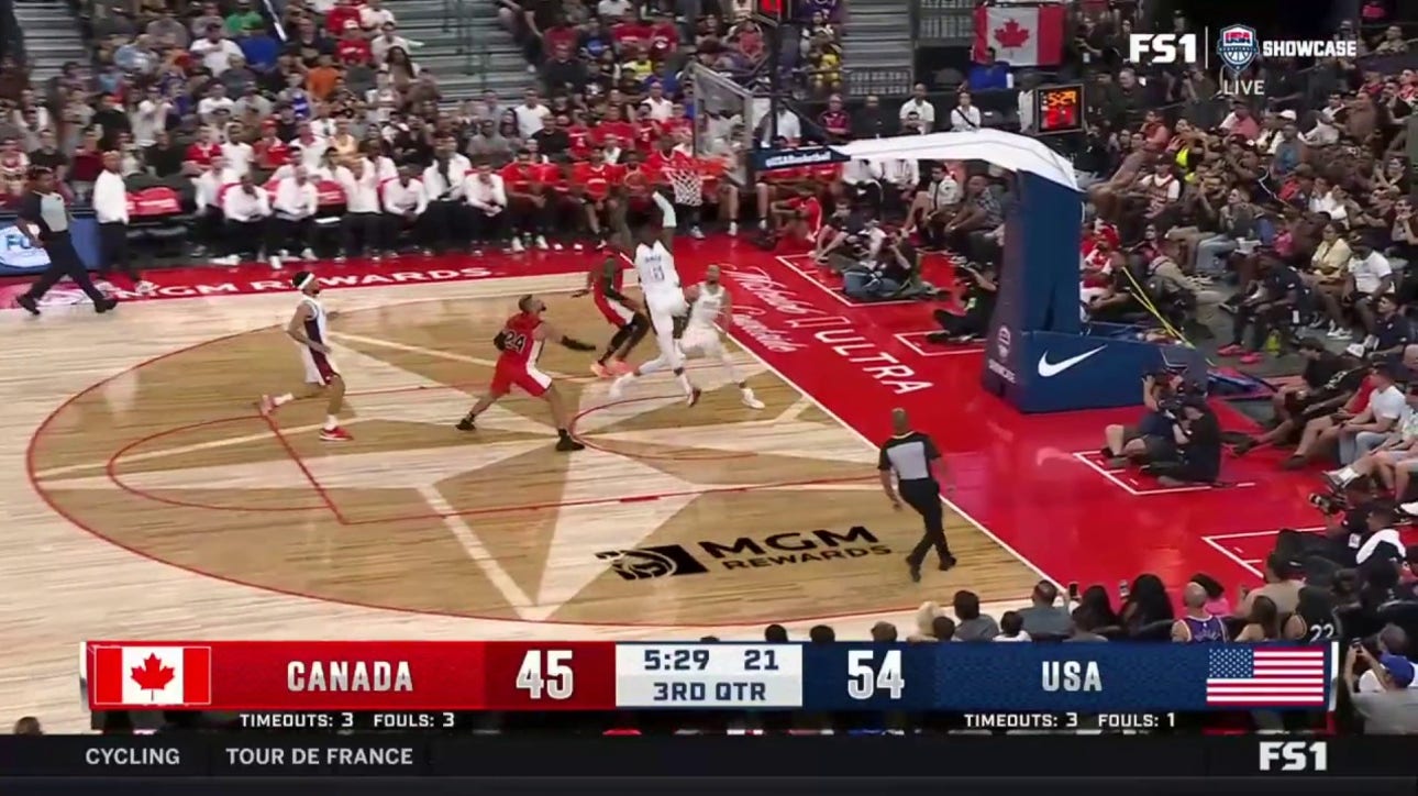 Steph Curry lobs it up to LeBron James for an alley-oop, extending United States' lead over Canada