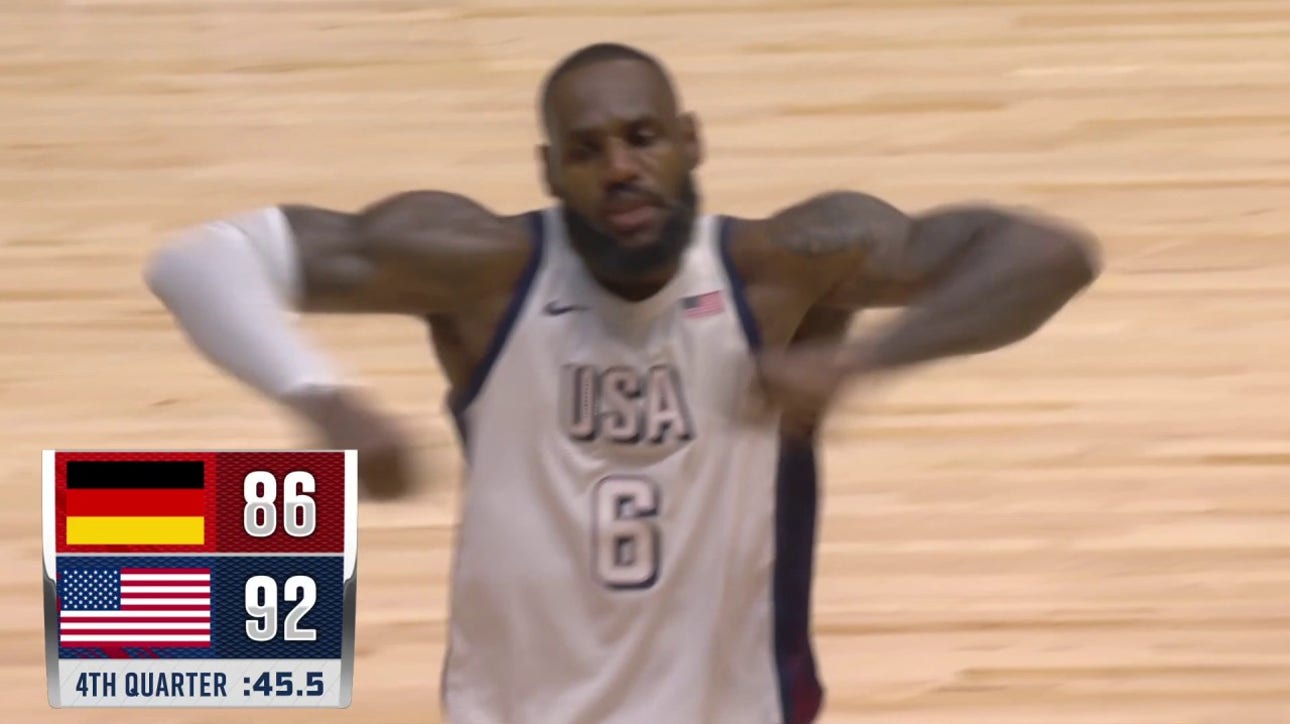 LeBron James bullies his way to the basket to seal United States' 92-88 victory over Germany.