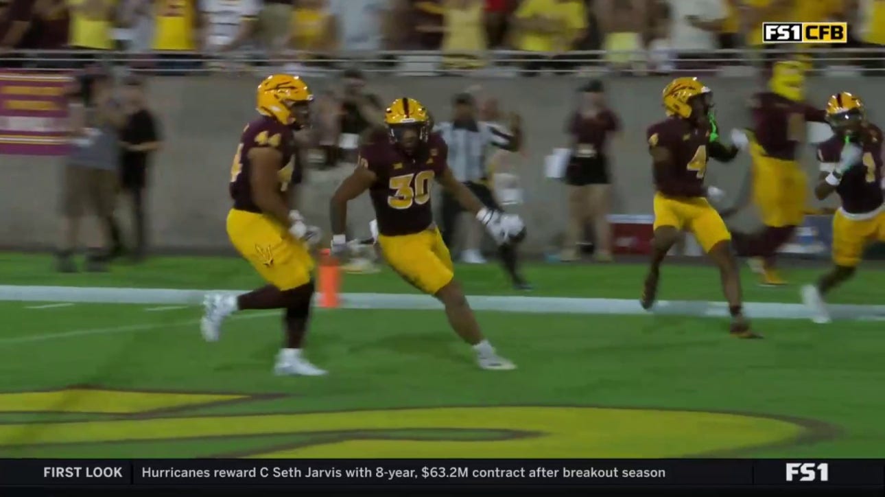 Arizona State's Zyrus Fiaseu intercepts Wyoming's Evan Svoboda and takes it 26 yards for a touchdown