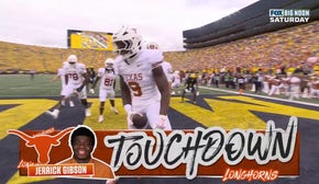 Jerrick Gibson punches in a seven-yard touchdown rush, extending Texas' lead over Michigan