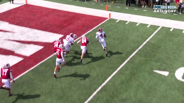 Alabama's Jalen Milroe rushes for a three-yard touchdown against Wisconsin