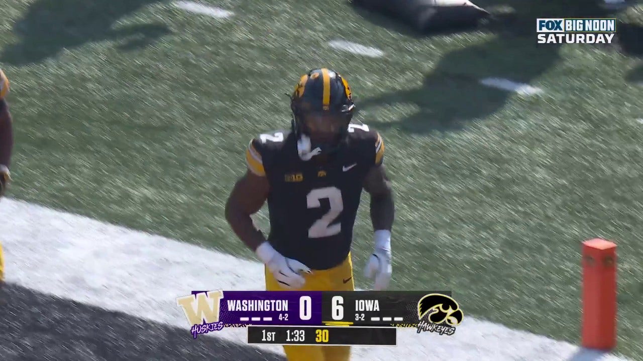 Kaleb Johnson rushes for an eight-yard TD to give Iowa a 7-0 over Washington