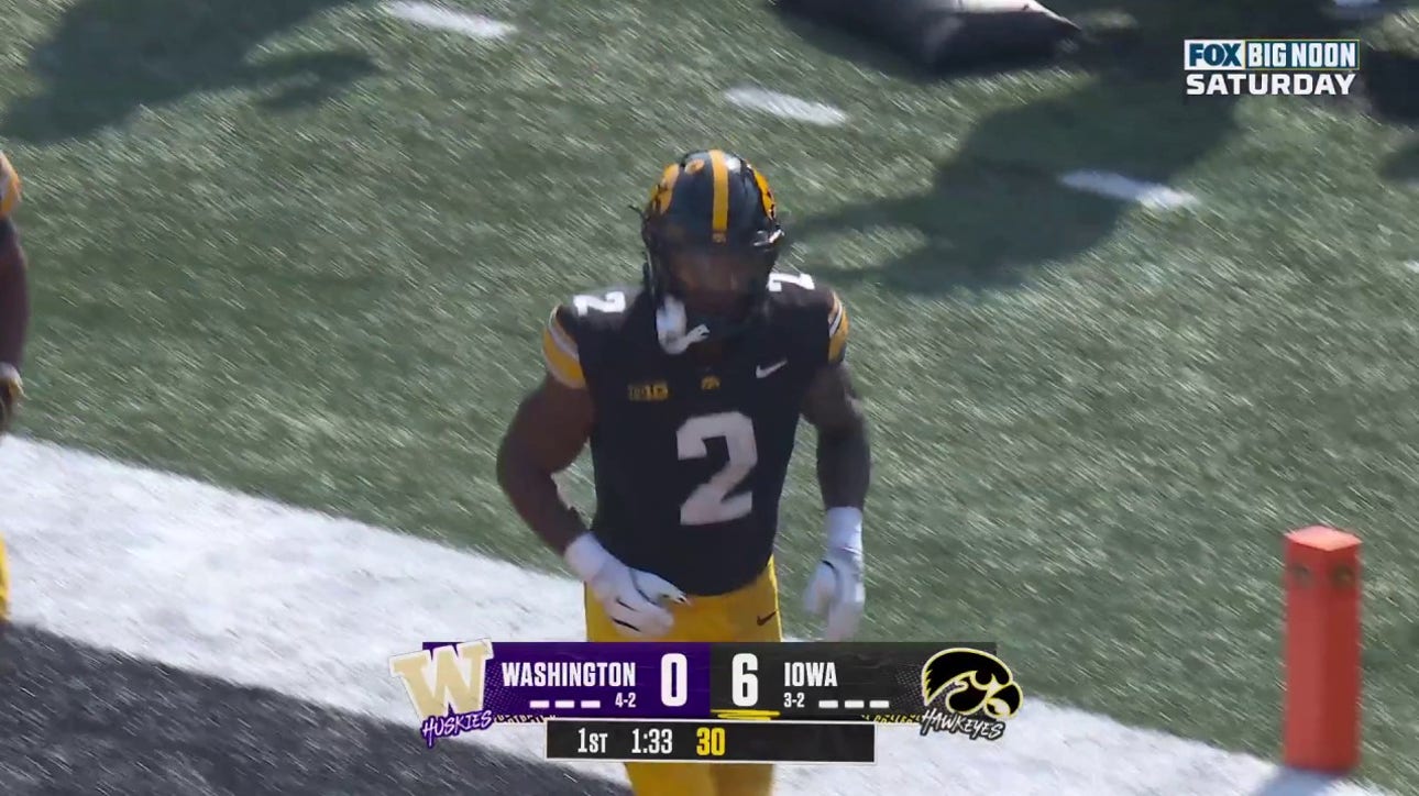 Kaleb Johnson rushes for an eight-yard TD to give Iowa a 7-0 over Washington