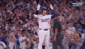 Shohei Ohtani flares a single to center field, increasing the Dodgers' lead over the Mets