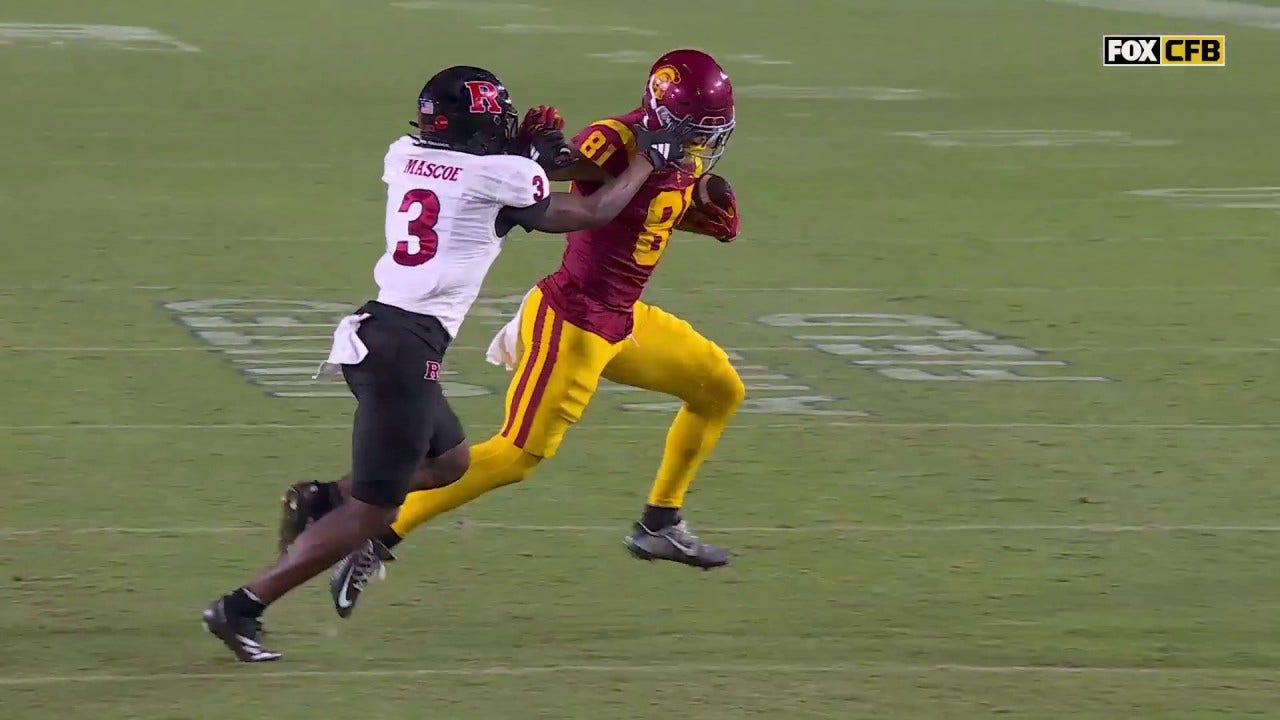 USC's Kyle Ford scores an 11-yard touchdown after a mean stiff arm to take 21-3 lead over Rutgers