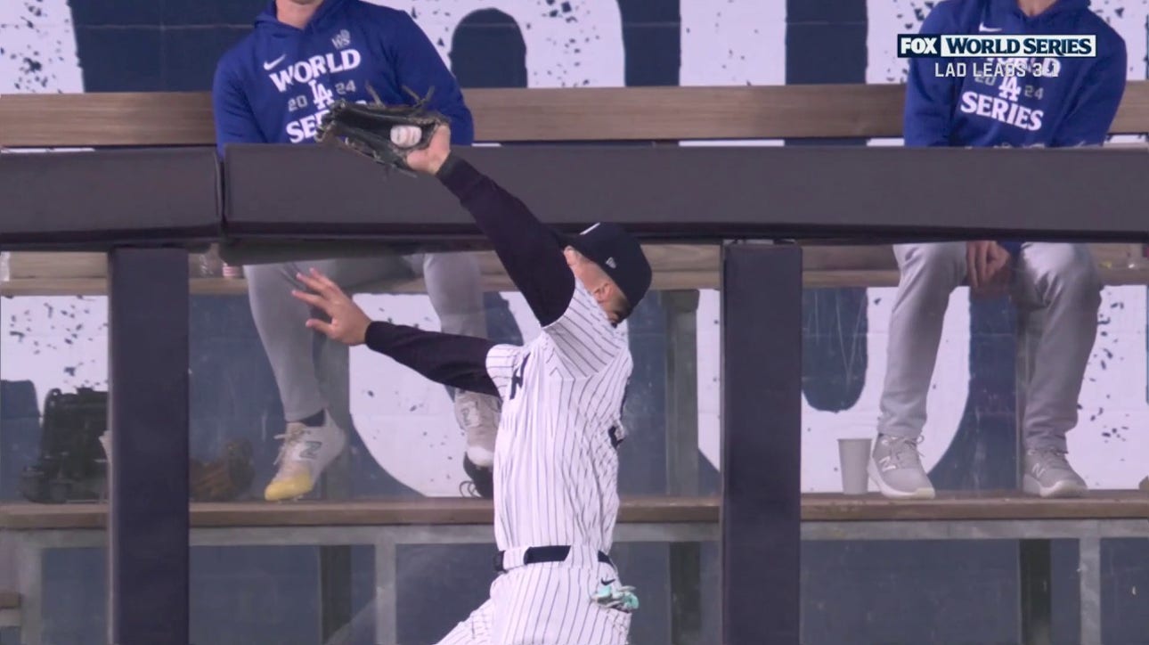 Aaron Judge hawks down a deep fly ball from Freddie Freeman to prevent Dodgers from scoring