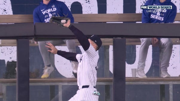 Aaron Judge hawks down a deep fly ball from Freddie Freeman to prevent Dodgers from scoring