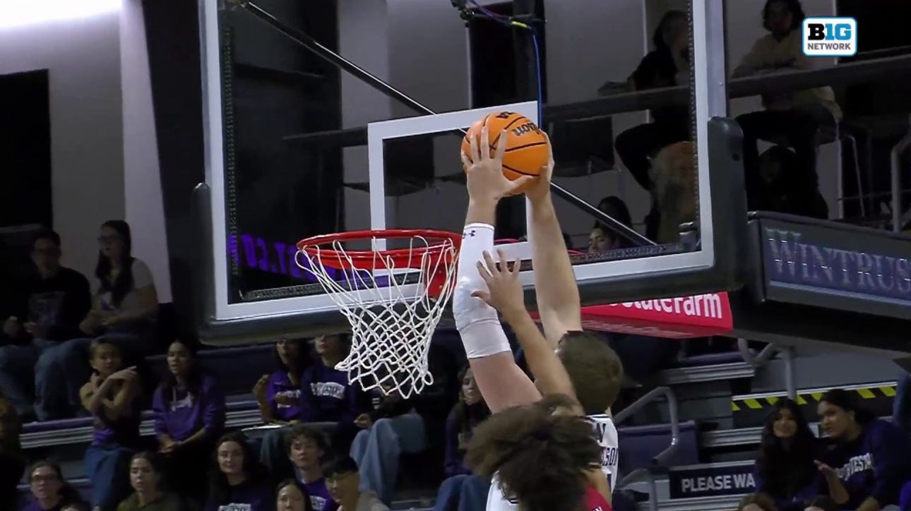 Matthew Nicholson throws down a two-handed slam to help Northwestern lead over UIC going into the half