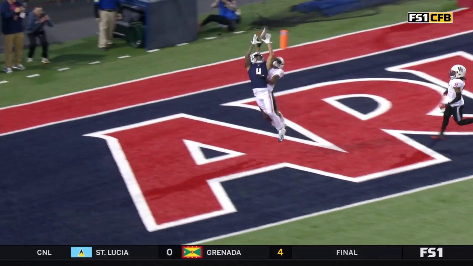 Arizona's Tetairoa McMillan goes long for a 33-yard touchdown reception to take a 7-0 lead over Houston