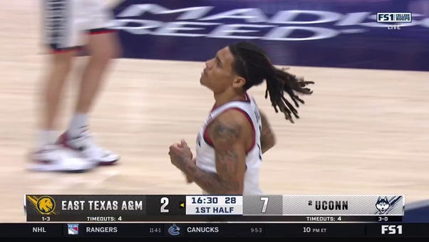  Alex Karaban's steal sets up Solo Ball for a powerful two-handed dunk as UConn leads East Texas A&M