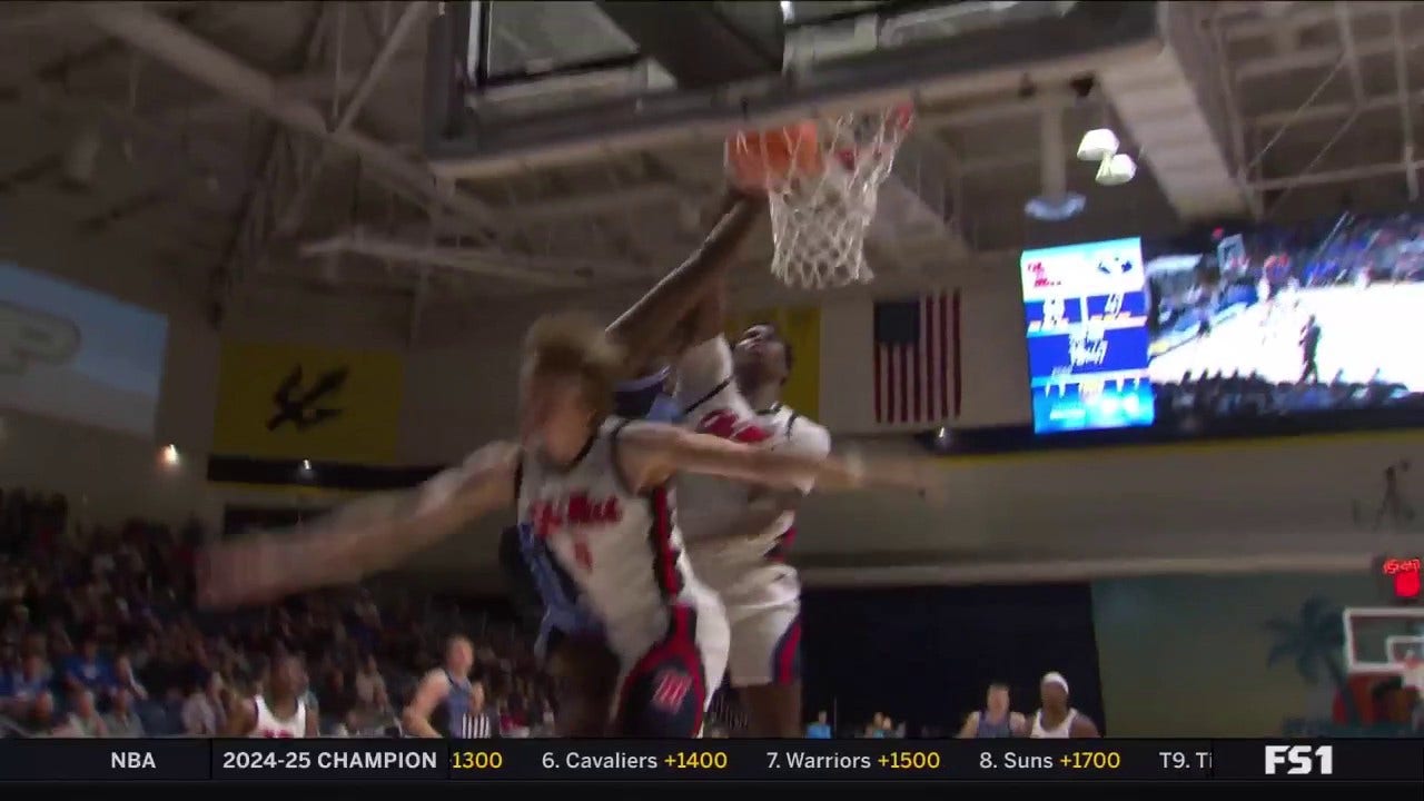 BYU's Fousseyni Traore posterizes two Ole Miss defenders with an authoritative slam