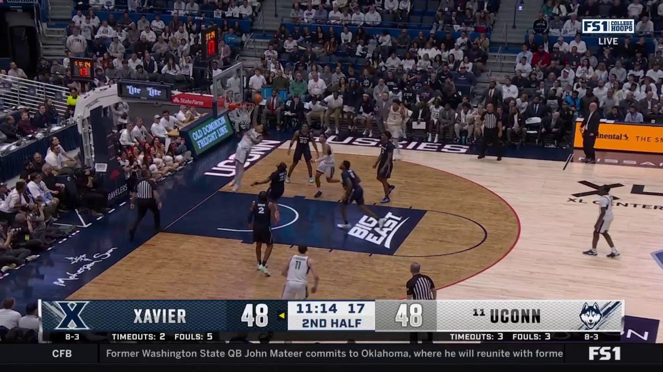 Solo Ball throws down a one-handed slam to give No. 11 UConn a 50-48 lead over Xavier