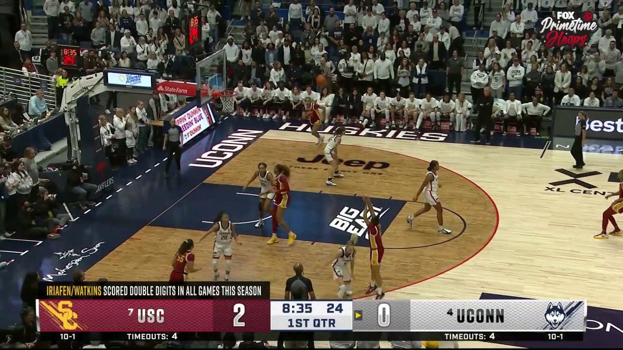 Juju Watkins drills a 3-pointer over Paige Bueckers, extending USC's lead over UConn