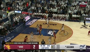 Juju Watkins drills a 3-pointer over Paige Bueckers, extending USC's lead over UConn 