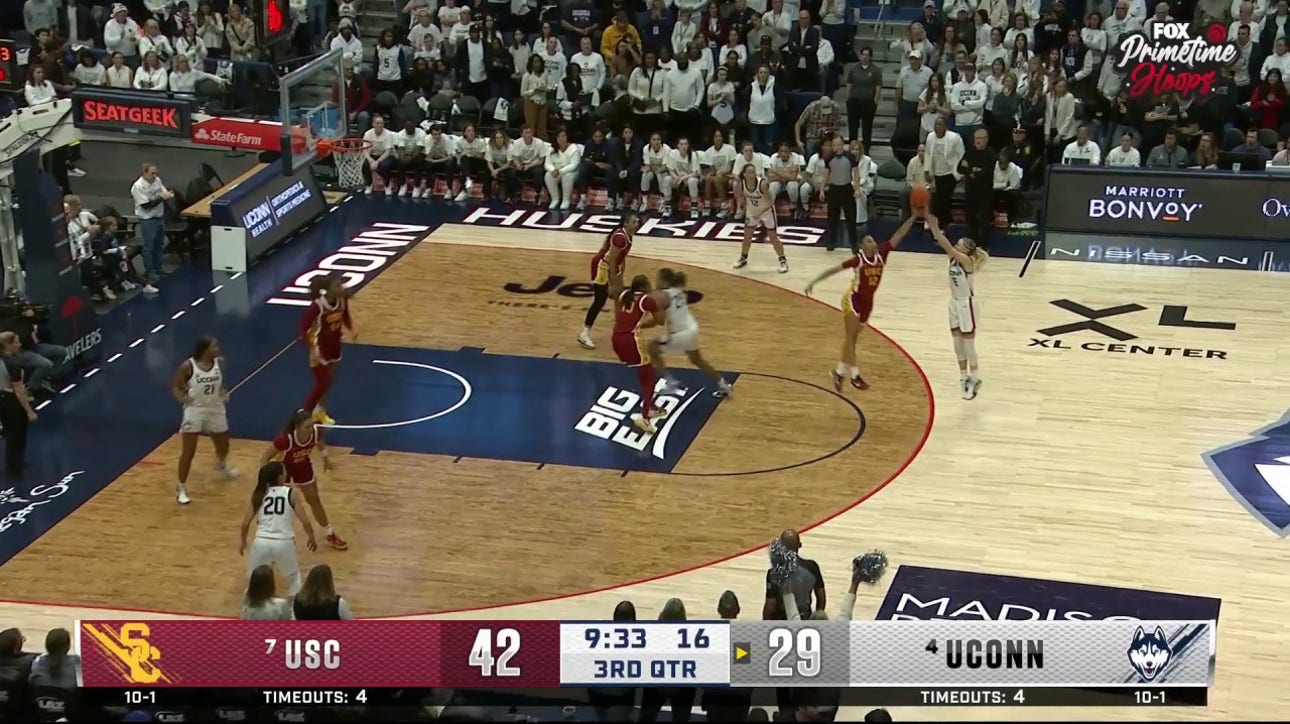 Juju Watkins blocks Paige Bueckers and lays it up on the other end, extending USC's lead vs. UConn