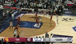 Juju Watkins blocks Paige Bueckers and lays it up on the other end, extending USC's lead vs. UConn