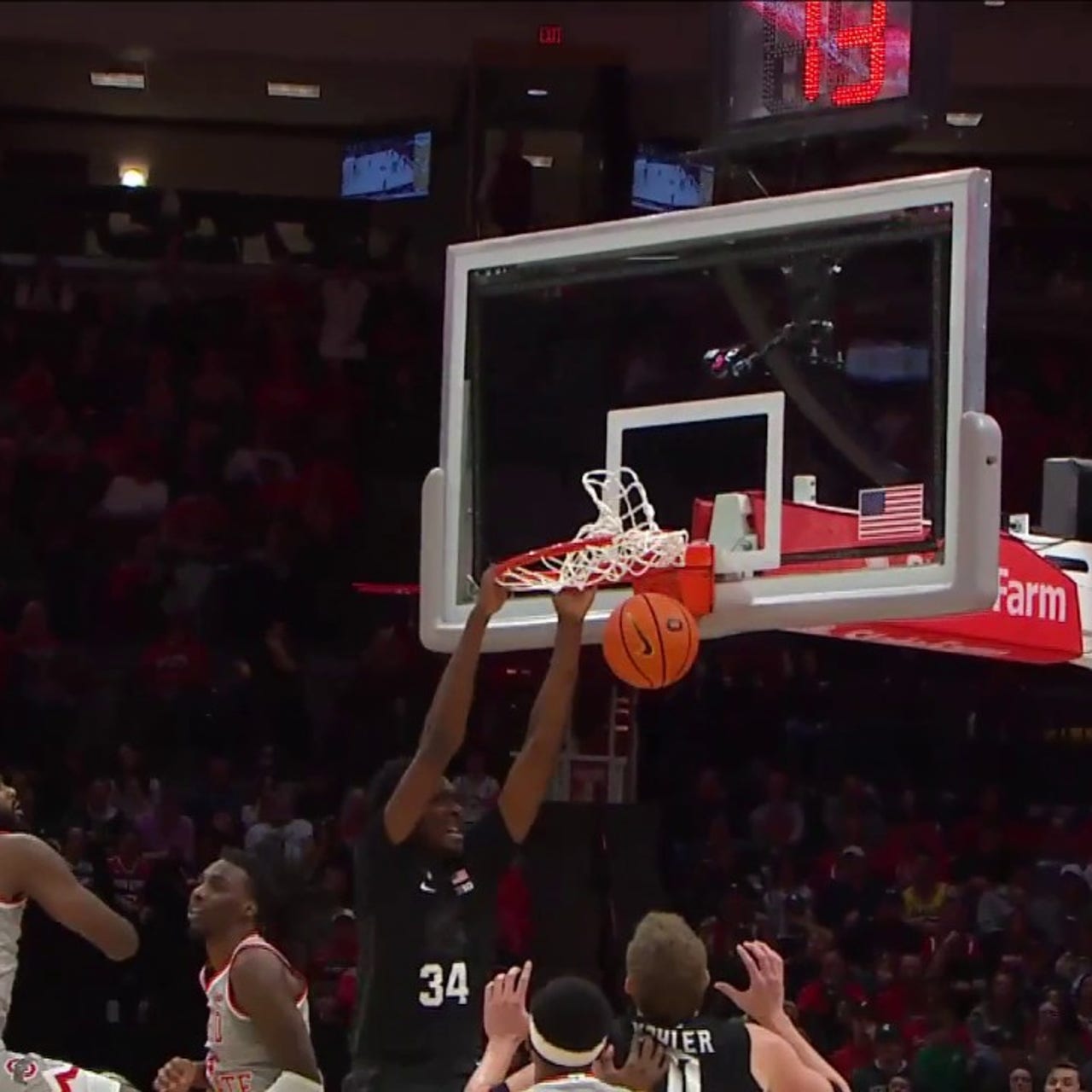 Xavier Booker slams down ferocious two-handed dunk to seal Michigan State's  69-62 victory over Ohio State