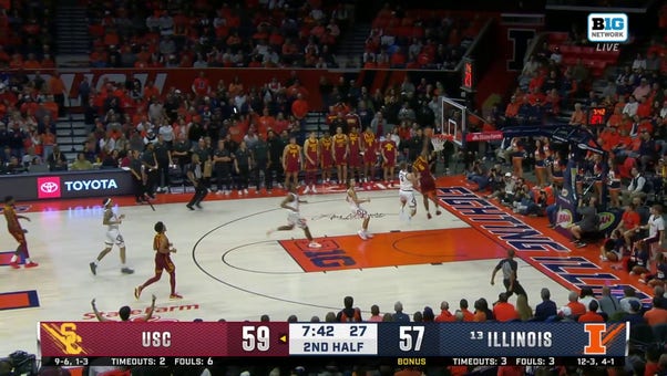 Wesley Yates III hammers the jam on the fastbreak, extending USC's lead over Illinois