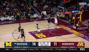 Dawson Garcia throws down a strong dunk, trimming the Michigan lead over Minnesota 