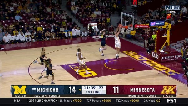 Dawson Garcia throws down a strong dunk, trimming the Michigan lead over Minnesota 