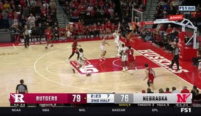 Dylan Harper finishes a tough layup, extending Rutgers' lead over Nebraska